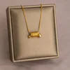 Collana in acciaio al titanio con molla dorata