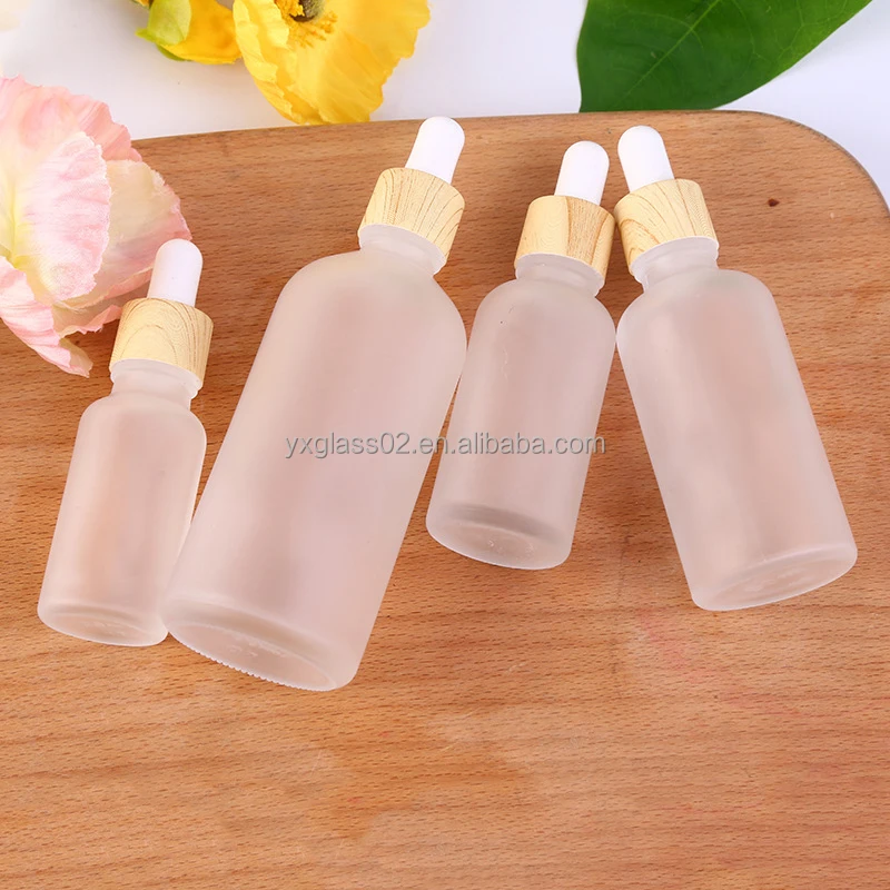 Frosted Essential Oil glass bottle serum glass bottle Flat Shoulder Dropper bottle with Plastic environmentally wood grain ring supplier