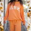 Orange,white letters with red edge