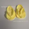 Light yellow baby flip-flops