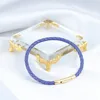 Chiusura oro + vera pelle di pecora viola