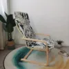 Sedia verde scuro con struttura in metallo con motivo floreale bianco