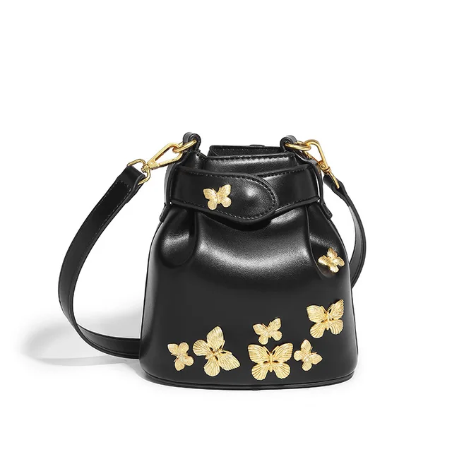 New Chinese 2024 new niche fashion oil wax leather senior sense bucket bag butterfly badge crossbody handbag tide