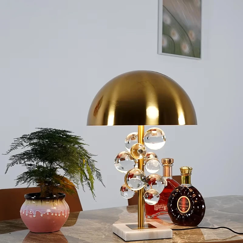 The Globo Table Lamp Consists of a Series of Glass Balls Floating on a Slender Metal Pole with a Metal Dome on Top to Make the