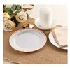 Plato de 15 cm (6 pulgadas) con borde dorado rosa.