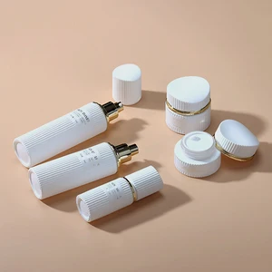 Pure White Striped Cosmetic Bottle Packaging with Personalized Striped Lid Can Be Customized with Color and LOGO