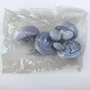 Paquete de 4 unidades recubiertas de tela gris.