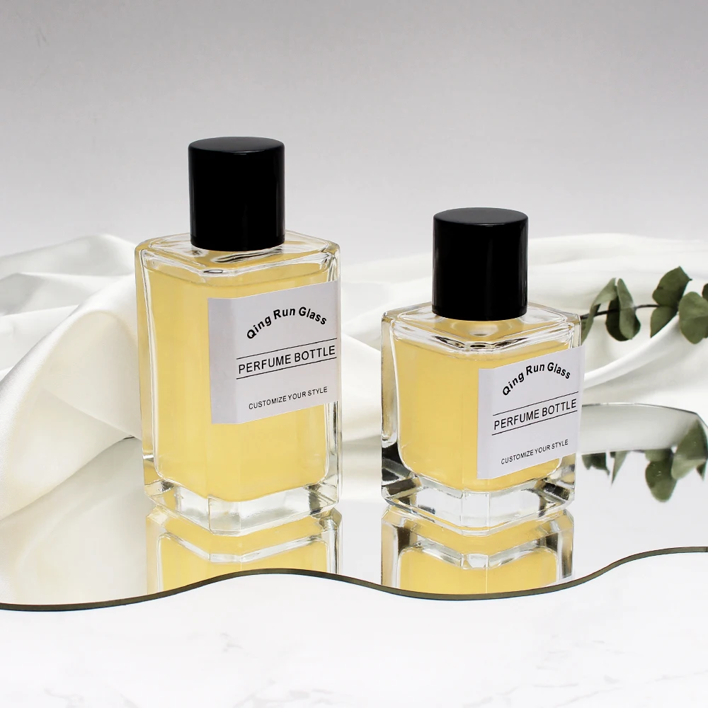 Clear Square Glass Perfume Bottles with Black Cylindrical Caps and Printed Labels