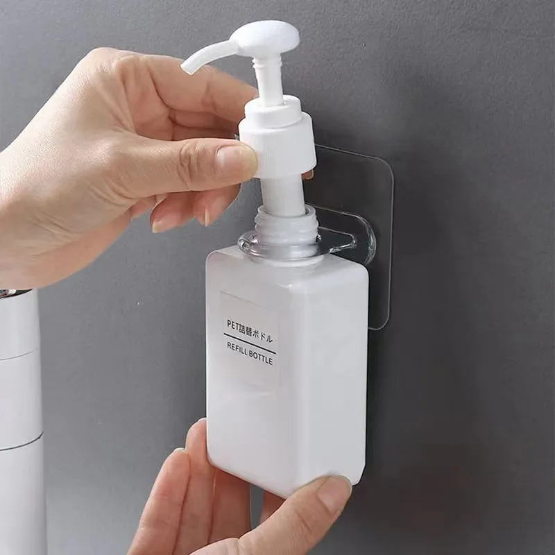 New transparent wall paste shower gel rack free punching toilet round traceless paste bath clip hand sanitizer rack manufacture