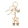 Porte-clés petit papillon doré-H