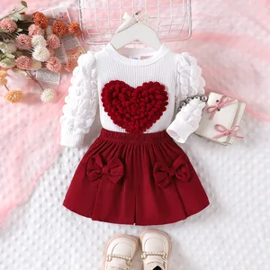 2026 Spring Autumn Children Clothes Manufacturer Puff Long Sleeve Heart Blouse Bows Short Skirt Two Piece Clothing for Kids Girl