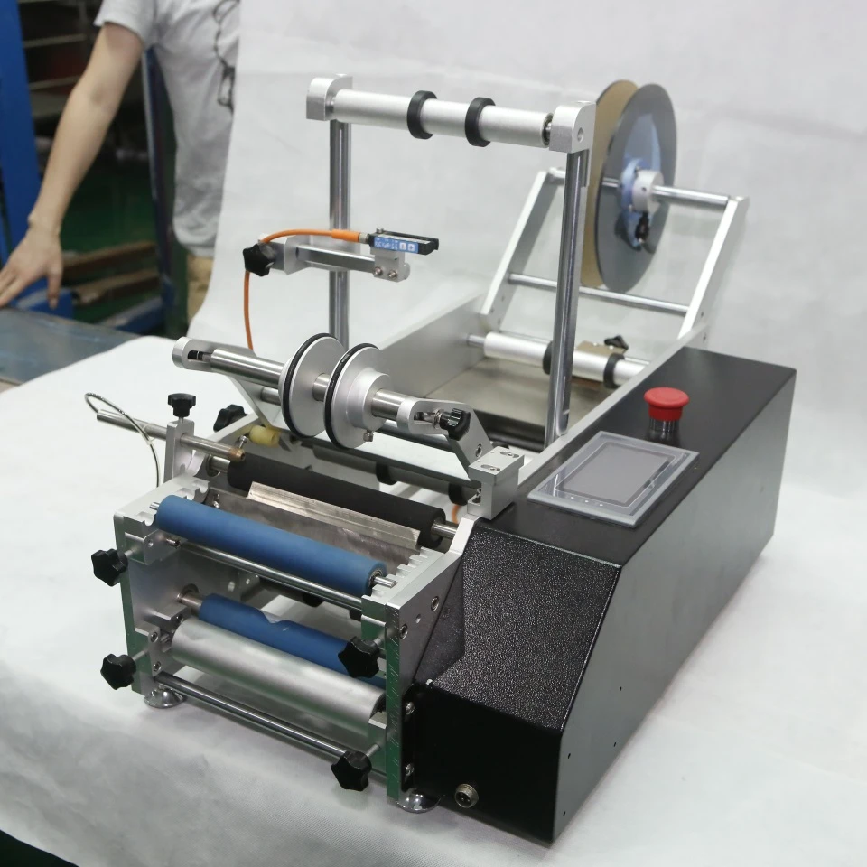 
Настольные полуавтоматические этикетировочные машины для круглых бутылок, банок, банок 