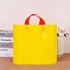 Yellow with red handl