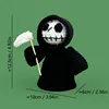 Black-robed grim reaper wielding scythe