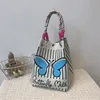Sac à main papillon bleu