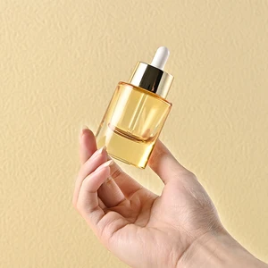 Thick Bottomed Oval 30ml Glass Dropper Bottle with Widened Gold Ring Semi Transparent Yellow Bottle That Can Screen Print logo