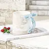Pearl-effect bow-mug-blue
