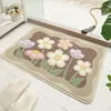 Fleur en forme de boule charnue brun foncé, grappe de fleurs brun chaud