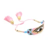 Cordoncino e nappa con perline rosa