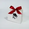 White bag with red ribbon