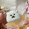 Mini oso blanco con nariz pequeña.