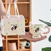ถ้วยแมวสีชมพูและช้อนพร้อมถุงของขวัญ