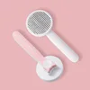 Round self-cleaning comb - peach pink