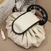 White donut-shaped handbag
