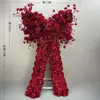 Roulettes pivotantes à motif floral avec nœud rouge