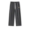 Dark gray origami-style pants label
