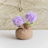 Bolso bola de pelo morado