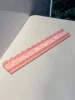 Poussoir rose en acrylique