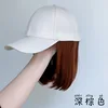 Beige hat, collarbone-length hair - dark brown