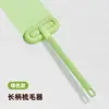 Green long-handled lint roller