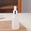 Silver ring + White plastic dropper + Transparent bottle