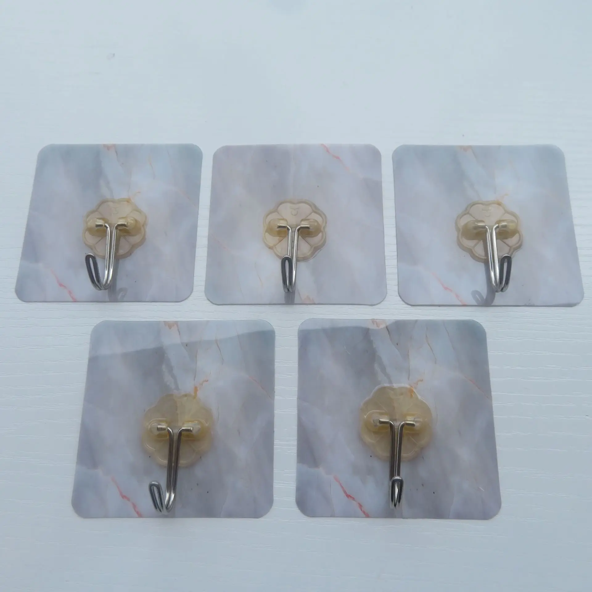 Strong traceless novelty hooks Transparent magic adhesive marble plum blossom metal stick no punch novelty hooks manufacture