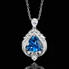 Blue pointed crystal pendant with cross chain