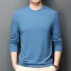 Azul bruma, cuello redondo, manga larga.