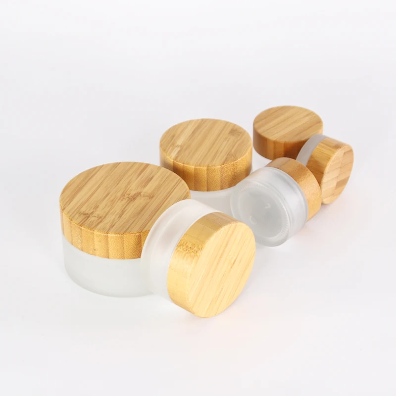 Hot selling natural 100g 50g 30g 15g 5g engravable frosted glass cosmetic facial cream jar with bamboo lid
