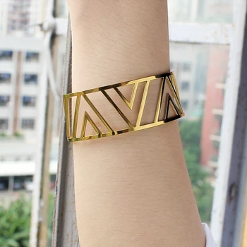 ゴールドオープンバングル Fusion 18kt yellow gold open bangle | Georg Jensen