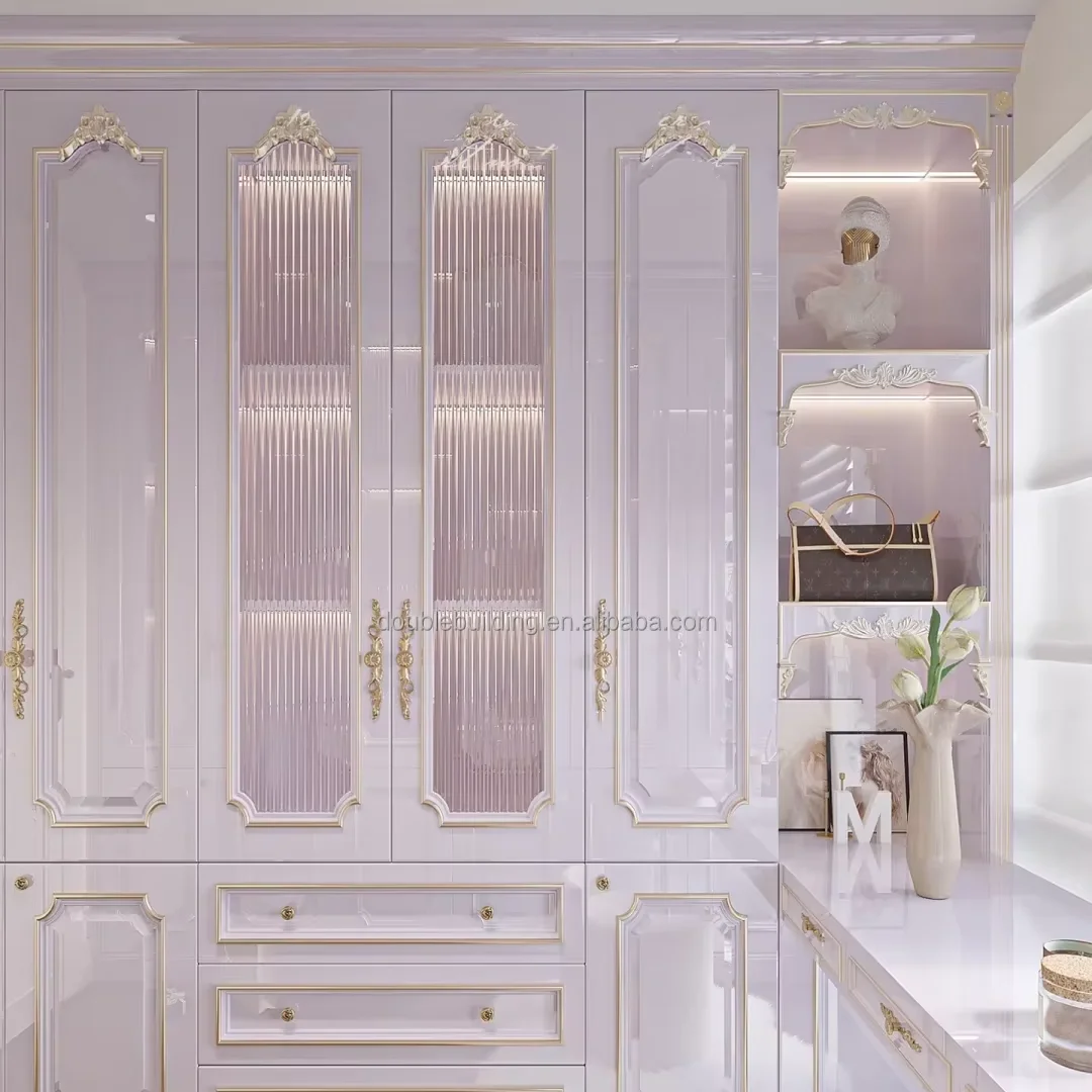 Luxury French style walk in closet wardrobe design with gold carve patterns doors