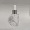clear bottle + shiny silver aluminum ring + white rubber head