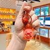 Portachiavi luminoso a forma di piccola tartaruga cartoon - orso rosso