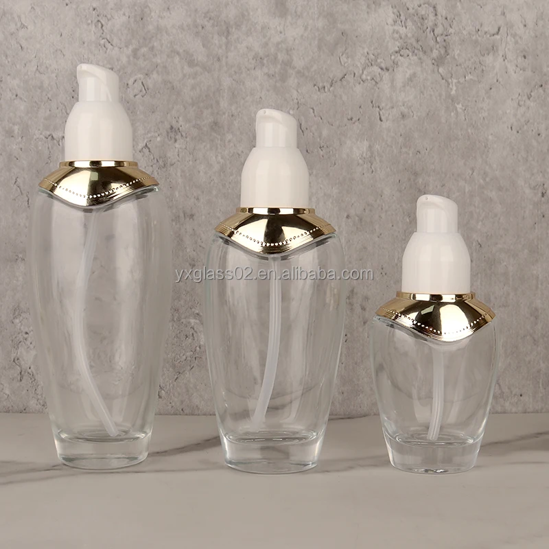 Luxury skin care product packaging glass bottle special oval bottle design with gold UV shoulder cover factory