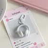 White earphone keychain