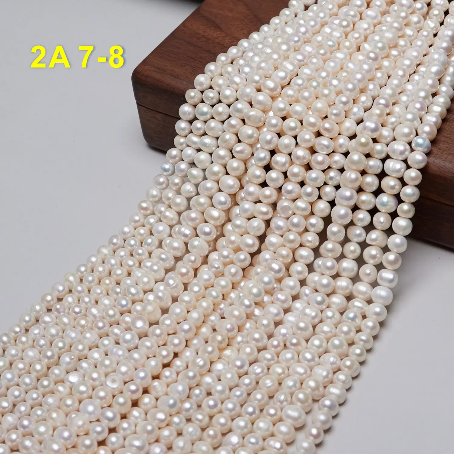 Zhuji Pearl Market Natural White Color 7-8mm Near Round Shape Freshwater Pearl Strands