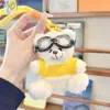 White bear yellow sweater lanyard glasses