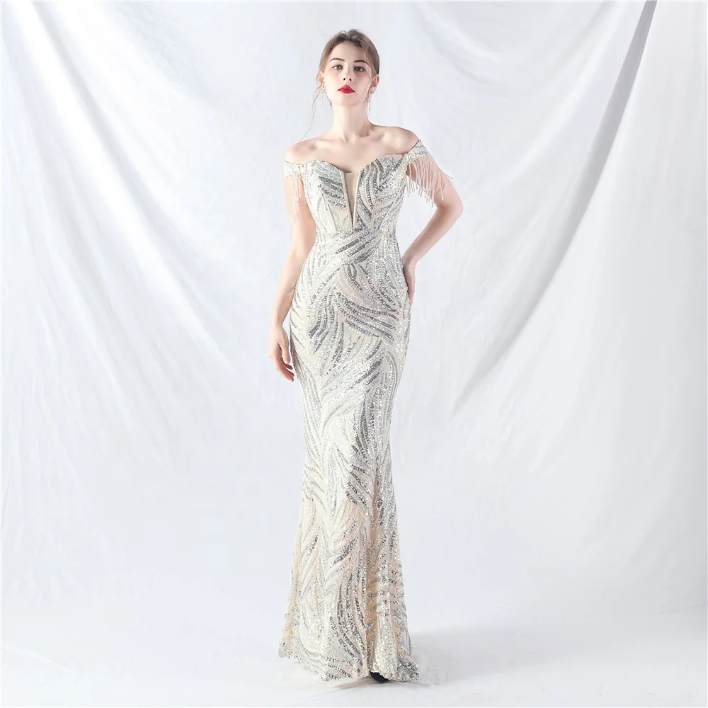 elegant silver wedding dresses Elegant Silver Sequin Evening Gown with Feather Accents