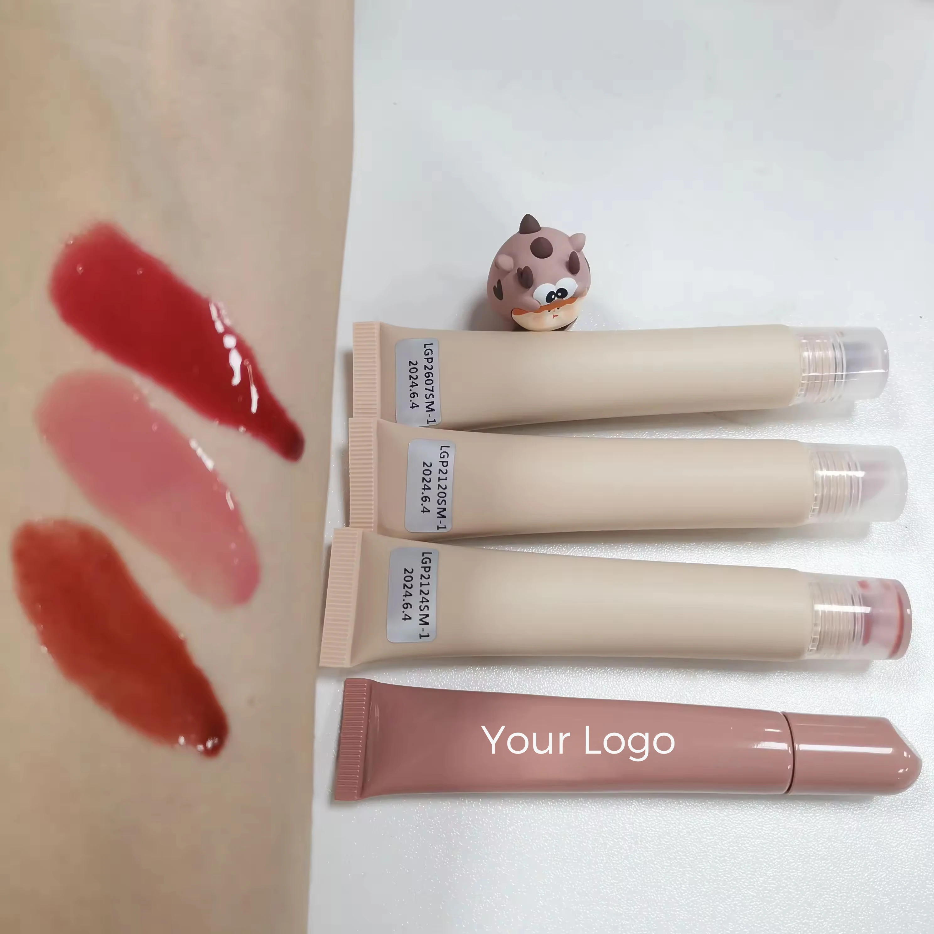 New Trendy Vegan Cosmetics Custom Hydrating Lip Tint and  Balm Soft Tube Fruit Flavored Herbal Lip Gloss with Private Label manufacture