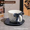 Pearlescent glaze black bowknot cup and saucer set
